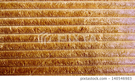 ochre corduroy textile displays soft ribbed parallel ridge pattern within cozy sustainable interior design setting 140546983