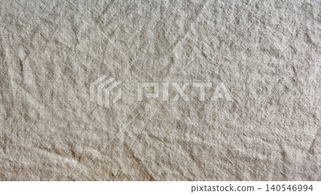 woven natural linen fabric texture displaying authentic sustainable tactile crease revealing organic weave woven natural linen fabric texture displaying authentic sustainable tactile crease revealing organic weave 140546994