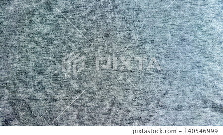 mottled grey cotton fabric texture shows intricate heathered weave pattern in soft natural lighting mottled grey cotton fabric texture shows intricate heathered weave pattern in soft natural lighting 140546999