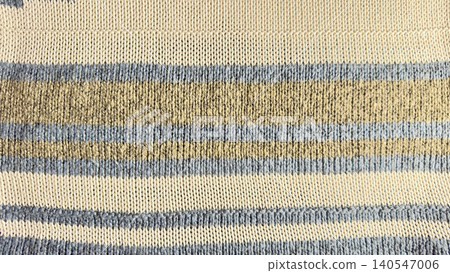 knitted striped fabric texture features organic cotton yarn in cream blue and beige for sustainable wellness aesthetic 140547006