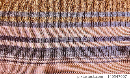 macro striped knit textile background showcases earth tone ochre and lavender wool fibers in a minimalist abstract weave 140547007