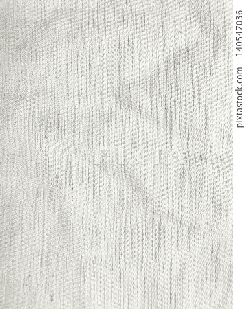 textured white linen fabric shows organic woven thread pattern in bright minimalist macro shot textured white linen fabric shows organic woven thread pattern in bright minimalist macro shot 140547036