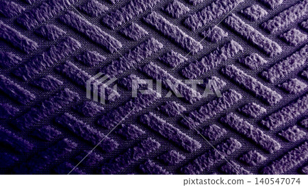 dark purple textured fabric displays geometric embossed herringbone pattern creating moody abstract background dark purple textured fabric displays geometric embossed herringbone pattern creating moody abstract background 140547074