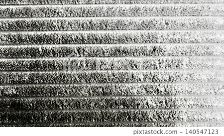 texture of a ribbed velvety corduroy fabric with high contrast shadows and light texture of a ribbed velvety corduroy fabric with high contrast shadows and light 140547123