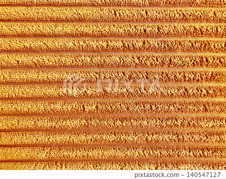 detailed high-resolution view of horizontally ribbed golden orange corduroy plush cotton texture for cozy interior design fabric detailed high-resolution view of horizontally ribbed golden orange corduroy plush cotton texture for cozy interior design fabric 140547127