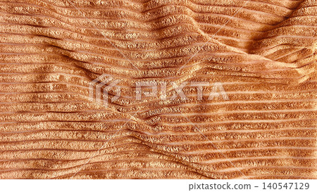 natural textured terracotta ribbed corduroy fabric textile with wavy folds and organic softness natural textured terracotta ribbed corduroy fabric textile with wavy folds and organic softness 140547129