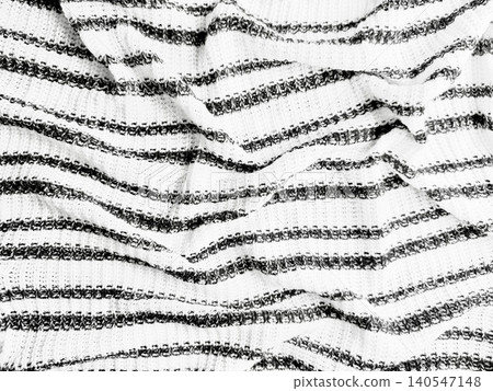 crumpled white knit fabric texture with dark gray wavy stripes for textile backdrop, clothing, abstract design crumpled white knit fabric texture with dark gray wavy stripes for textile backdrop, clothing, abstract design 140547148