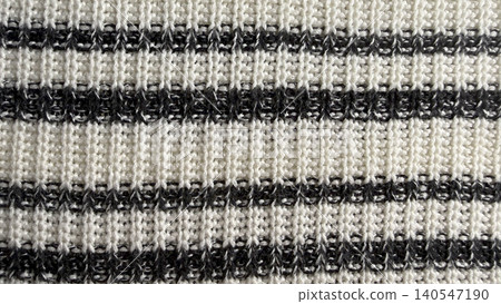 black and white striped knitted fabric unveils intricate textured weave pattern in macro closeup black and white striped knitted fabric unveils intricate textured weave pattern in macro closeup 140547190