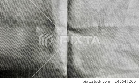 raw denim fabric macro texture revealing dramatic seams and soft folds in moody monochrome raw denim fabric macro texture revealing dramatic seams and soft folds in moody monochrome 140547209