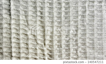 soft white waffle weave cotton fabric reveals intricate texture and tactile depth in detailed macro closeup soft white waffle weave cotton fabric reveals intricate texture and tactile depth in detailed macro closeup 140547211
