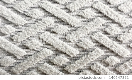 intricate plush white textile showcasing raised rectangular tufts in soft staggered geometric pattern intricate plush white textile showcasing raised rectangular tufts in soft staggered geometric pattern 140547221