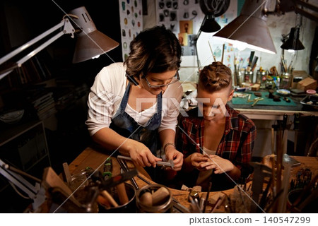 Team, women and tools with jewelry making in workshop with craftsmanship, skill and handmade design for creativity. Fitting, artist and creative people at workspace with top view for handicraft hobby 140547299
