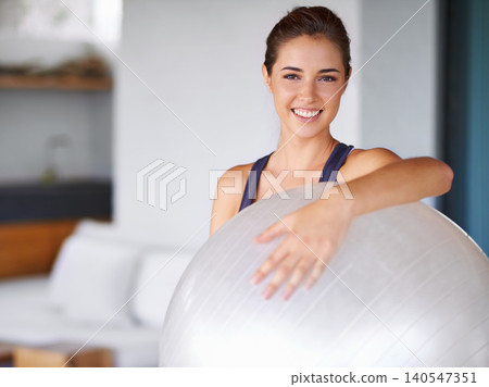 Portrait, woman and ball for pilates, fitness and yoga as sport, workout and training for energy. Personal trainer, smile and equipment for exercise, health and wellness in core balance and muscle Portrait, woman and ball for pilates, fitness and yoga as sport, workout and training for energy. Personal trainer, smile and equipment for exercise, health and wellness in core balance and muscle 140547351