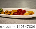 Mixed snacks on white tray 140547820