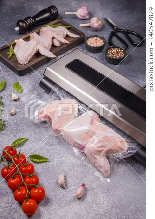 Raw chicken wings vacuum sealing for food preservation 140547829