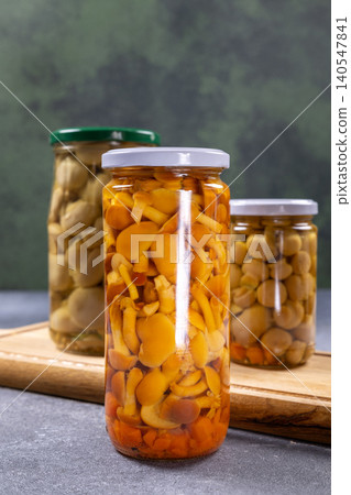 Pickled mushrooms in glass jars for food preservation Pickled mushrooms in glass jars for food preservation 140547841