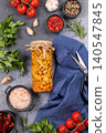 Pickled mushrooms in jar with ingredients for home preserving 140547845