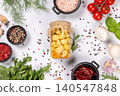 Marinated mushrooms in jar with fresh ingredients and spices 140547848