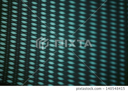 Abstract pattern of light and shadow created by perforated metal surface with teal and black colors, showcasing a rhythmic design of elongated shapes Abstract pattern of light and shadow created by perforated metal surface with teal and black colors, showcasing a rhythmic design of elongated shapes 140548415