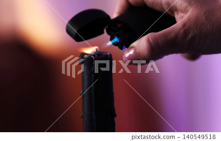Woman Lighting Candle With Lighter Woman Lighting Candle With Lighter 140549518