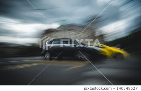 Blurred Rushing Cars Moving Fast Along Urban Street In City Blurred Rushing Cars Moving Fast Along Urban Street In City 140549527