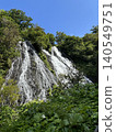 Waterfall in early summer that shines in the fresh greenery 140549751