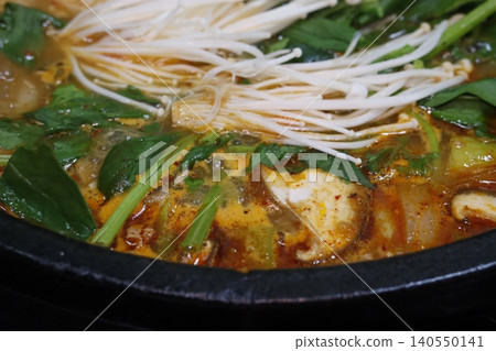 Steaming Hot Pot with Mushrooms and Greens Steaming Hot Pot with Mushrooms and Greens 140550141