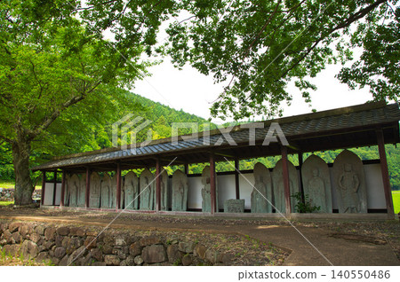 Ichijōdani, the ruins of Nishiyama Kōshōji Temple amidst the fresh greenery. Ichijōdani, the ruins of Nishiyama Kōshōji Temple amidst the fresh greenery. 140550486