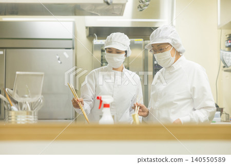 Part-time staff working in white coats Part-time staff working in white coats 140550589