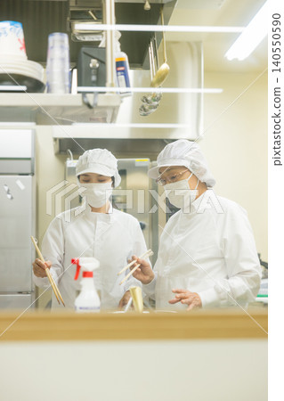 Part-time staff working in white coats Part-time staff working in white coats 140550590