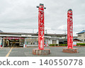 The uniquely designed wooden monument, Jangseung, stands tall in the plaza in front of Koma Station (Hidaka City, Saitama Prefecture). 140550778