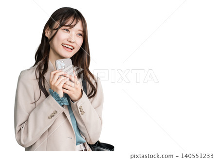 Young Asian businesswoman in urban office district holding smartphone Young Asian businesswoman in urban office district holding smartphone 140551233