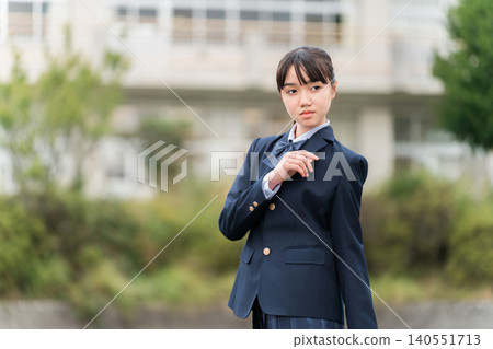 Junior high school, high school, and elementary school students in uniform standing in front of the school building Junior high school, high school, and elementary school students in uniform standing in front of the school building 140551713