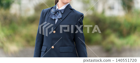 Middle school, high school, and elementary school girls in school uniforms standing in front of the school building. Middle school, high school, and elementary school girls in school uniforms standing in front of the school building. 140551720