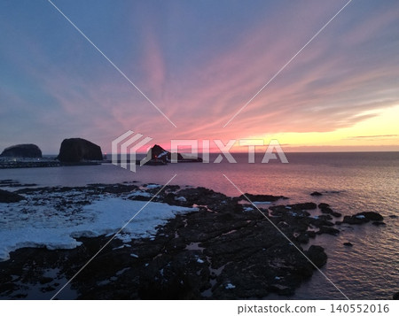 A stunning aerial view of a vibrant sunset from the coastline of Utoro, Hokkaido. 140552016