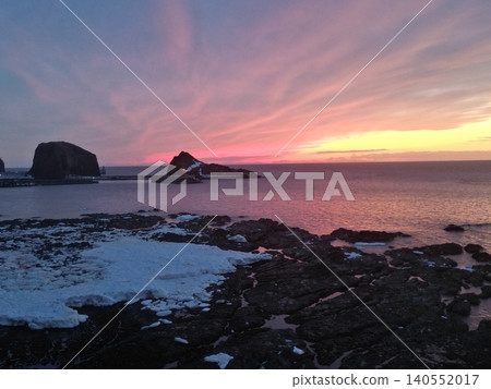 A stunning aerial view of a vibrant sunset from the coastline of Utoro, Hokkaido. 140552017