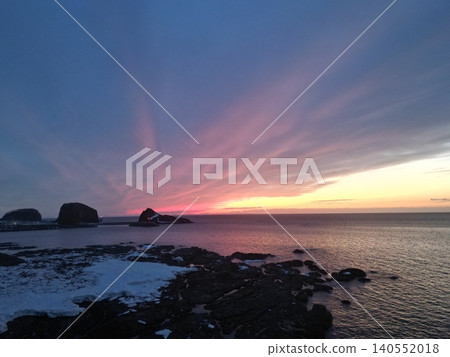 A stunning aerial view of a vibrant sunset from the coastline of Utoro, Hokkaido. 140552018