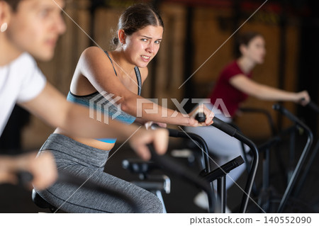Woman in the top is engaged in an airbike Woman in the top is engaged in an airbike 140552090