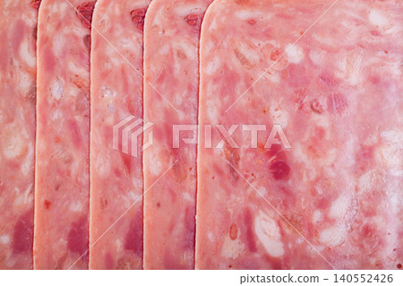 Slicing chopped ham from pork meat, no people Slicing chopped ham from pork meat, no people 140552426