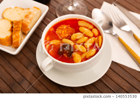 Tasty stew of asturian beans in gravy with sausages Tasty stew of asturian beans in gravy with sausages 140553530