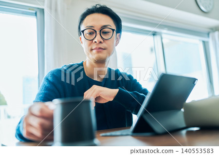 Japanese men working remotely Japanese men working remotely 140553583