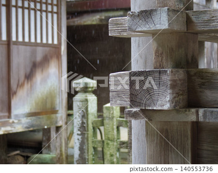 Wooden framework overlapping with the eaves of an ancient temple Wooden framework overlapping with the eaves of an ancient temple 140553736