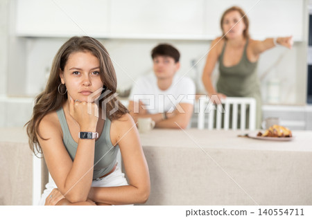 Woman and guy swear at girl. Mom and older brother scold young girl for unsuccessful studies at university. Complex intergenerational relationships Woman and guy swear at girl. Mom and older brother scold young girl for unsuccessful studies at university. Complex intergenerational relationships 140554711