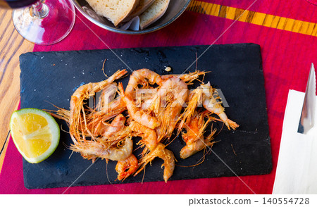 Breaded shrimps served with slice of lime Breaded shrimps served with slice of lime 140554728