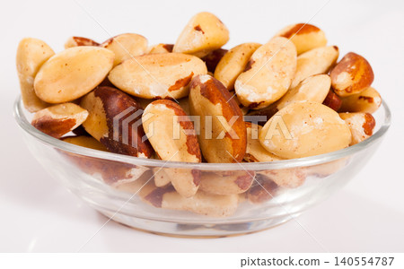 Brazilian nut in glass bowl Brazilian nut in glass bowl 140554787