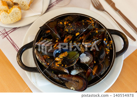 Grilled mussel dish with minced meat Grilled mussel dish with minced meat 140554978