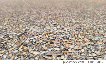Brown pebble stone ground texture with shallow depth for architectural material design background 140555042