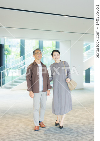 A couple talking in the lobby A couple talking in the lobby 140555051