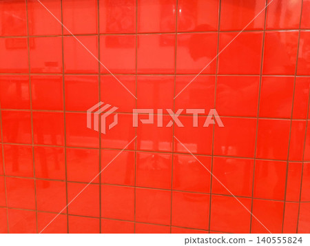 Bright Red Glossy Square Tiles on a wall surface Bright Red Glossy Square Tiles on a wall surface 140555824
