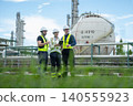 Team of engineers collaborating on safety inspections industrial site photography outdoor close-up workplace safety 140555923